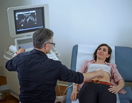 Woman in hospital getting sonogram photo