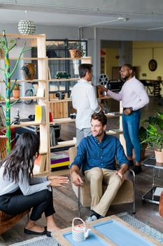 Business team having an informal meeting in loft office photo