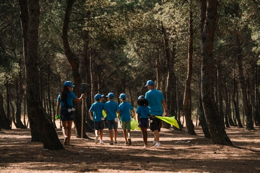 Group of volunteers collecting garbage in a park photo