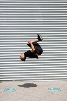 Man exercising Parkour discipline in the city photo