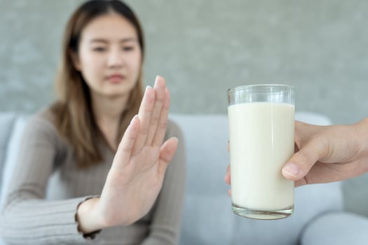 Milk allergens, Sick sad unhealthy ill allergic woman, runny stuffy sore nose suffer from intolerance allergy trigger symptoms. abdominal pain, allergens, nut protein, rash, death, food allergy photo