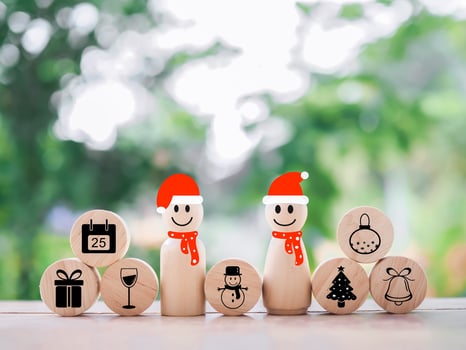 Wooden snowman with Christmas icons for Christmas decorations background photo