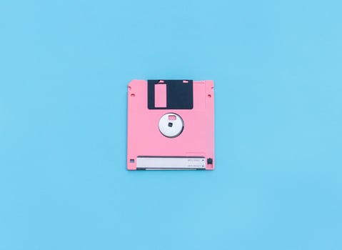 Floppy disk isolated on blue background. After some edits. photo