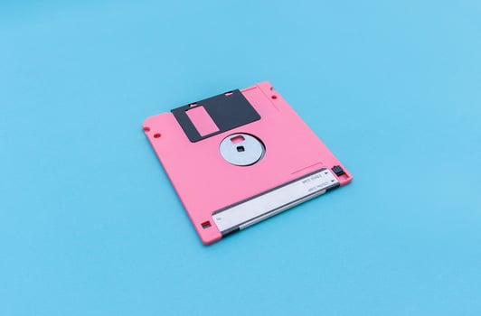 Floppy disk isolated on blue background. After some edits. photo