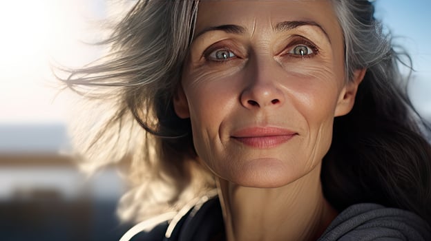 Beautiful middle-aged woman in her 50s looking at the camera Beautiful face, good health, cosmetics, skin care photo