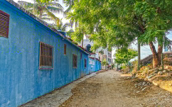 Typical beautiful colorful tourist street sidewalk city Puerto Escondido Mexico. photo