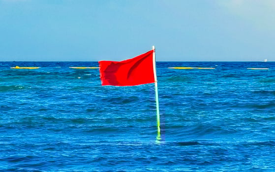 Red flag swimming prohibited high waves Playa del Carmen Mexico. photo