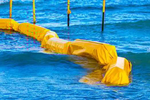 Blue water waves ocean with buoy buoys ropes nets Mexico. photo