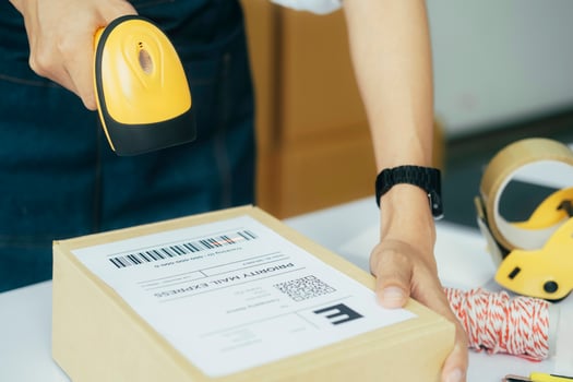 Scanning parcel barcode before shipment. photo