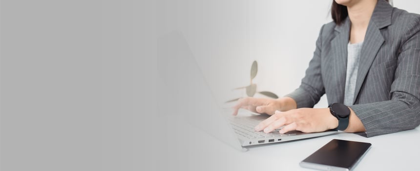 Attractive business woman Asian in suits  are smiling while working with computer at office. Customer service assistant working in office. panorama banner background photo