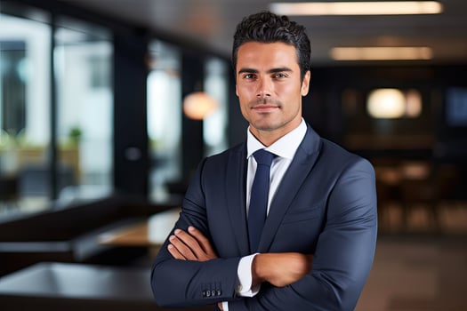 Portrait of a confident young businessman standing with arms crossed in office, An intriguing portrait of a businessperson dressed in a suit, AI Generated photo