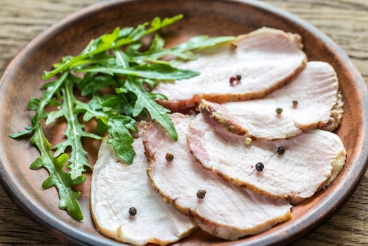 Baked meat with fresh rocket salad photo
