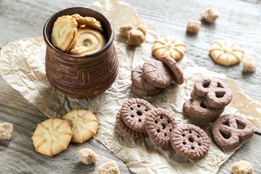 Butter and chocolate chip cookies on the wooden background photo