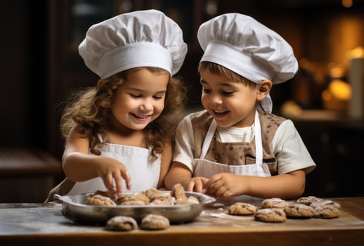 Couple of children preparing Christmas cookies photo