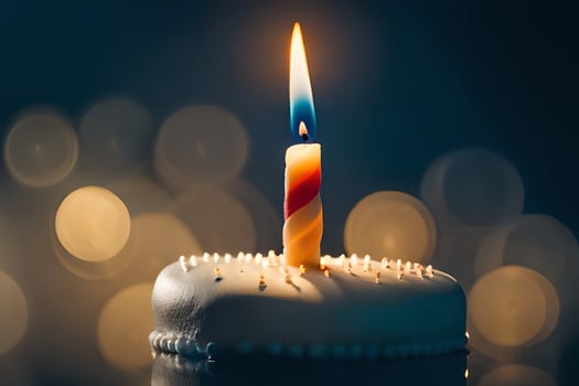 a single candle is lit on a cake. AI-Generated photo
