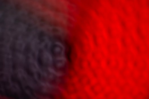 Defocused abstract background of red, black and white colors. Toned. photo