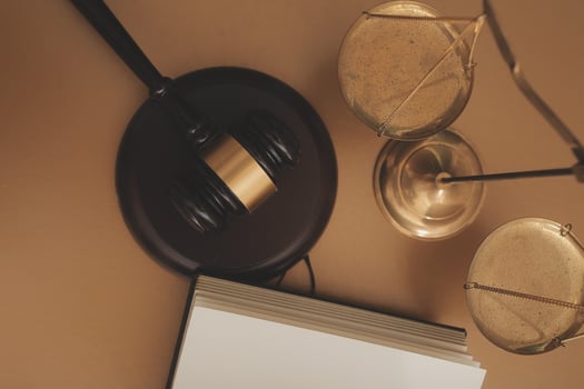 Business and lawyers discussing contract papers with brass scale on desk in office. Law, legal services, advice, justice and law concept picture with film grain effect photo