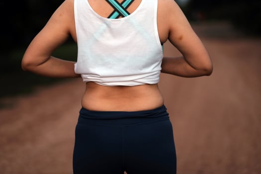 Women body fat belly. Obese woman hand holding excessive belly fat. diet lifestyle concept to reduce belly and shape up healthy stomach muscle. photo
