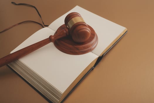 Business and lawyers discussing contract papers with brass scale on desk in office. Law, legal services, advice, justice and law concept picture with film grain effect photo