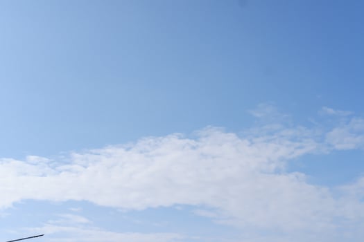 Blue sky background with white clouds photo