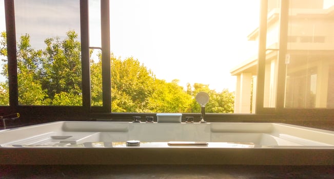 bathtub open window  There is an orange sun during the summer. photo
