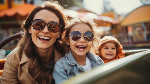 Happy family plays on the amusement park photo
