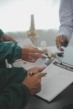 Group of doctors reading a document in meeting room at hospital photo