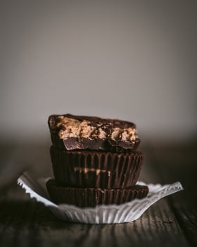 Chocolate bars on a wooden background. Selective focus. Toned. photo