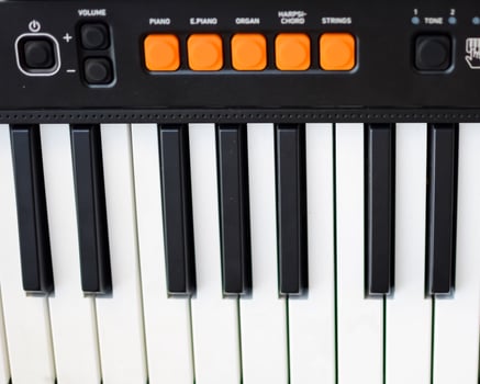 Close-up of piano keys. Piano black and white keys and Piano keyboard musical instrument placed at the home balcony during sunny day. photo