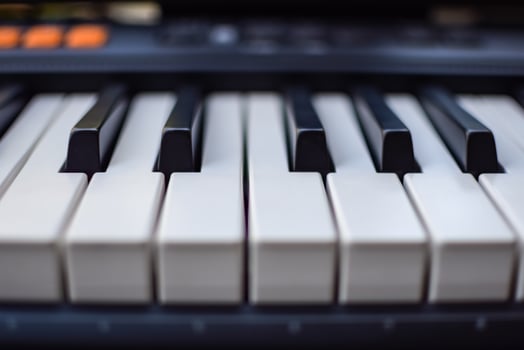 Close-up of piano keys. Piano black and white keys and Piano keyboard musical instrument placed at the home balcony during sunny day. photo