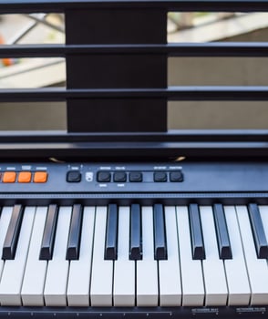 Close-up of piano keys. Piano black and white keys and Piano keyboard musical instrument placed at the home balcony during sunny day. photo