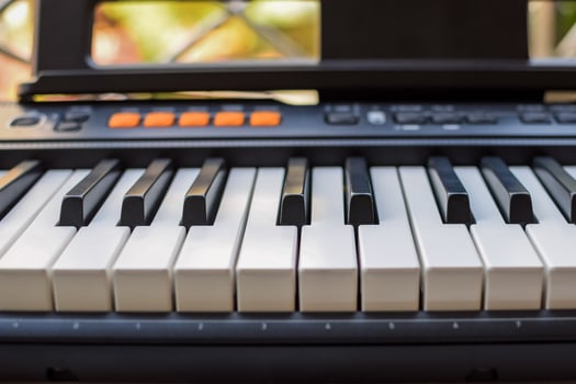 Close-up of piano keys. Piano black and white keys and Piano keyboard musical instrument placed at the home balcony during sunny day. photo