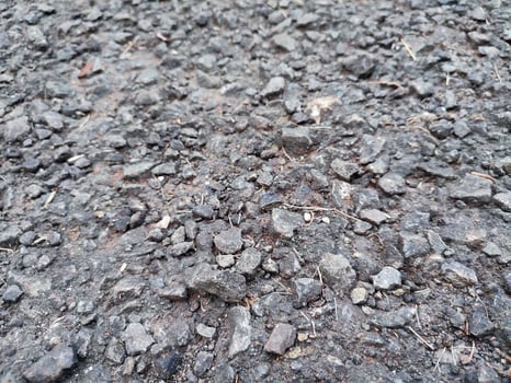 asphalt rough and rocky grunge surface, texture background, gray paved road photo