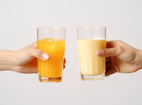 Hand with glass of orange juice photo