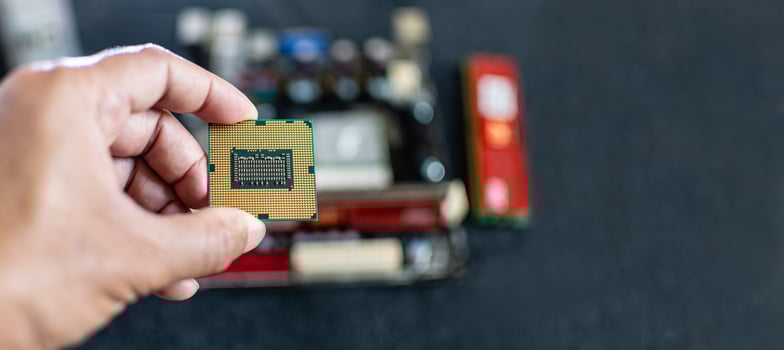 Closeup, Man holding CPU, Central processor Unit, Concept for fix, repair, mend,  restore, service, cobble, retrieve, recondition, selective focus, copy space on right for design, blurred background photo