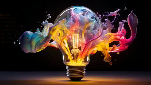 Vibrant explosion. Bursting light bulb creates a colorful masterpiece. Perfect for creative concepts photo