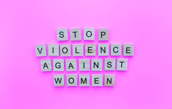 November 25, International Day for the Elimination of Violence against Women, minimalistic banner with the inscription in wooden letters photo