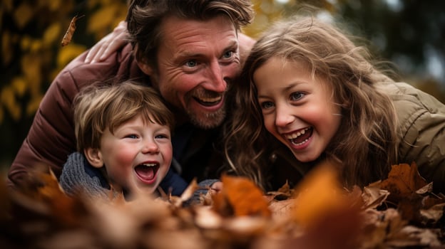 Family playing in leaves in backyard photo