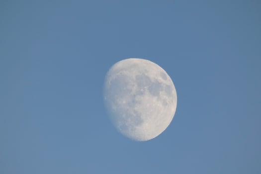 Moon seen during the day in crescent photo