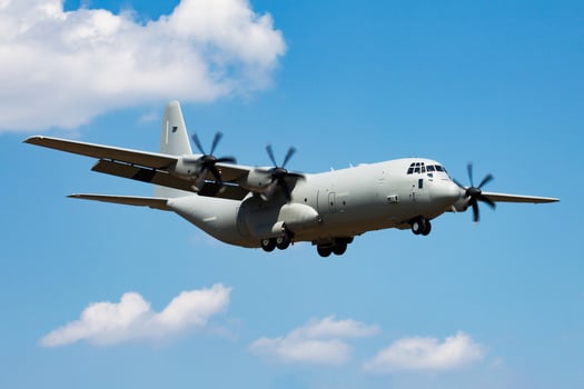 Untitled military transport plane at air base. Airport and airfield. Air force and army flight operation. Aviation and aircraft. Air lift. Military industry. Fly and flying. photo