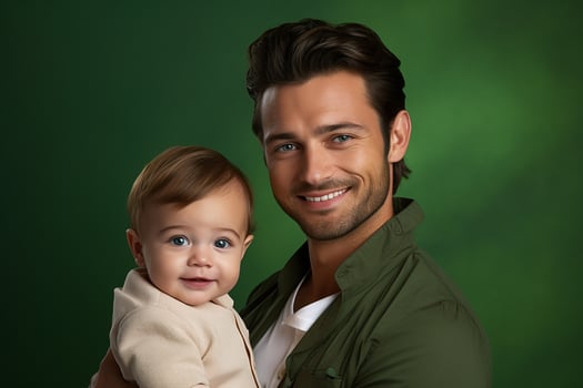 Ai generated studio portrait of handsome man holding infant baby in his hands on different colour background photo
