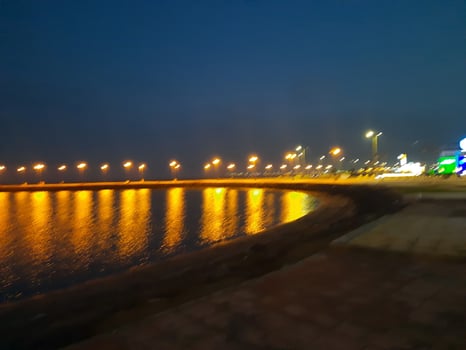 Beautiful morning view of Al Qunfudhah Beach, Saudi Arabia. The lights on the beach are creating a beautiful scene in the morning. photo