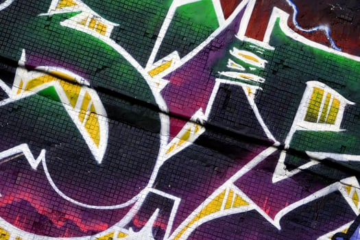Colorful background of graffiti painting artwork with bright aerosol strips on metal wall photo