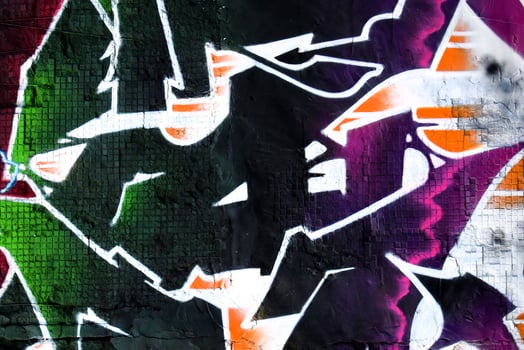 Colorful background of graffiti painting artwork with bright aerosol strips on metal wall photo