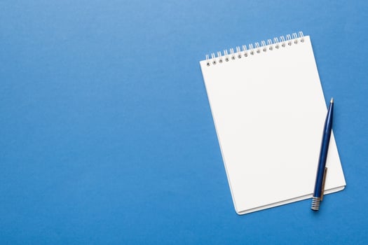 Blank notebook with pen on white background. Back to school and education concept photo
