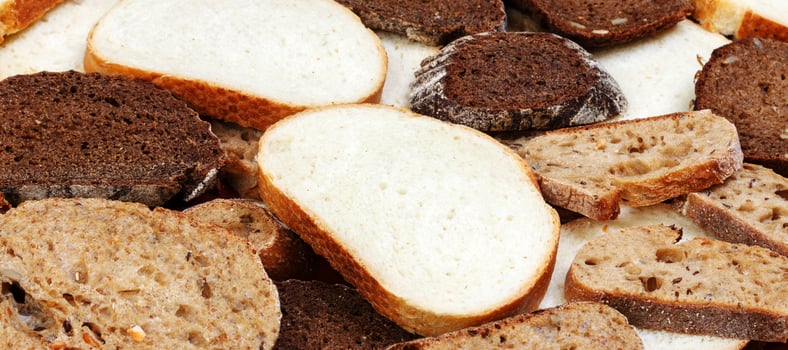 Sliced white and brown loaf of bread photo