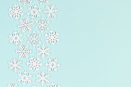 Set of white snowflakes on colorful background. Top view of Christmas ornament. New Year time concept with empty space for your design photo