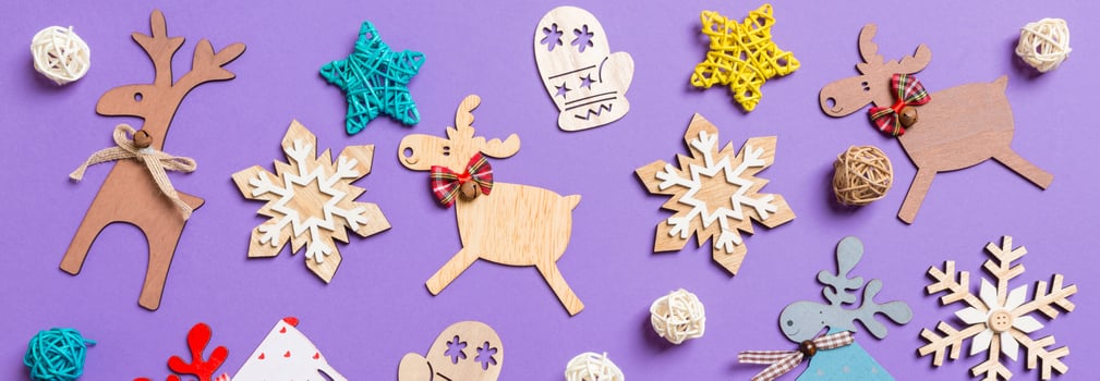 Banner Festive decorations and toys on purple background. Merry Christmas concept photo