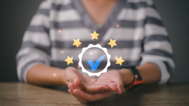 ISO certification and standardization concept. Hand shows the sign of the top service Quality assurance 5 stars, Guarantee, Standards, photo