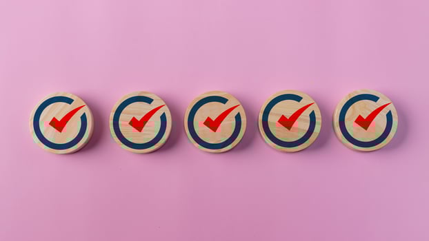 Check mark icon on wooden blocks. Checklists, Reminder Apps, Task lists, Surveys, assessment online forms. Goals achievement and business success. Company objective achievement and business success. photo